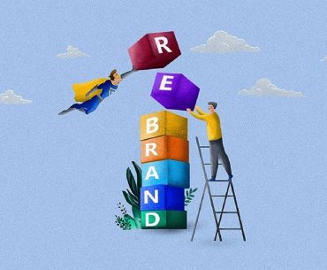 people stacking blocks that spell out the word "rebranding"
